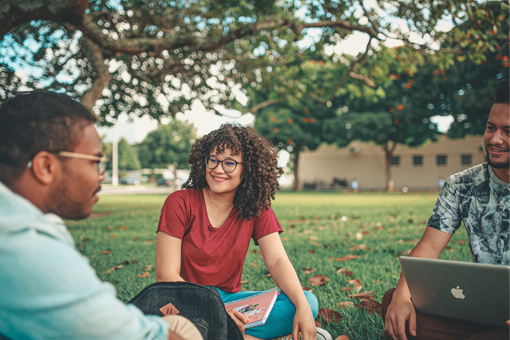 three students talking