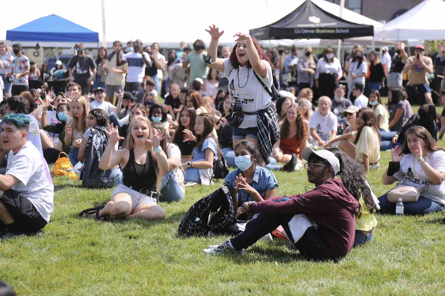 Group of students sitting on lawn