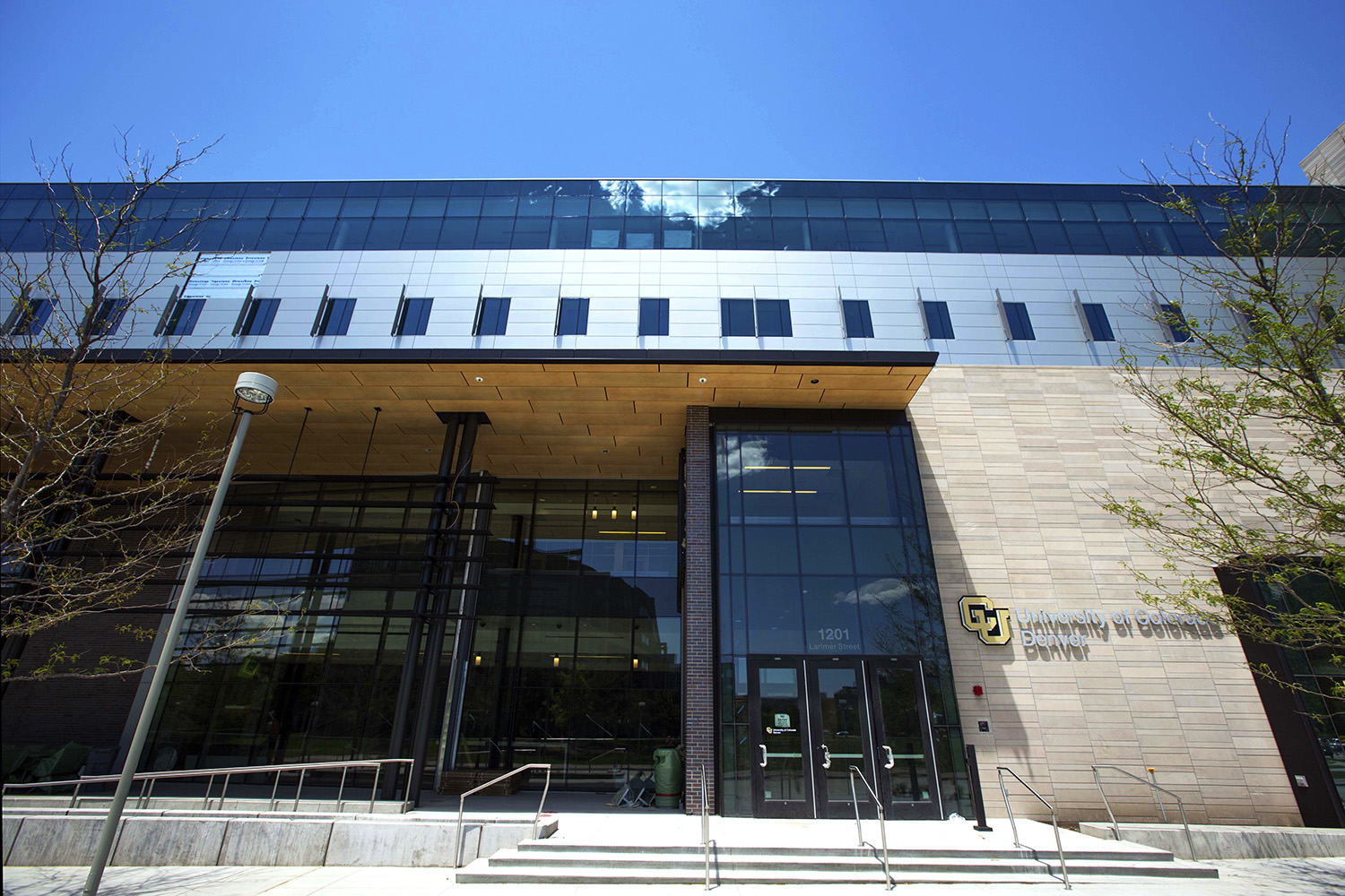 A photo of the front of the CU building on larimer street in denver