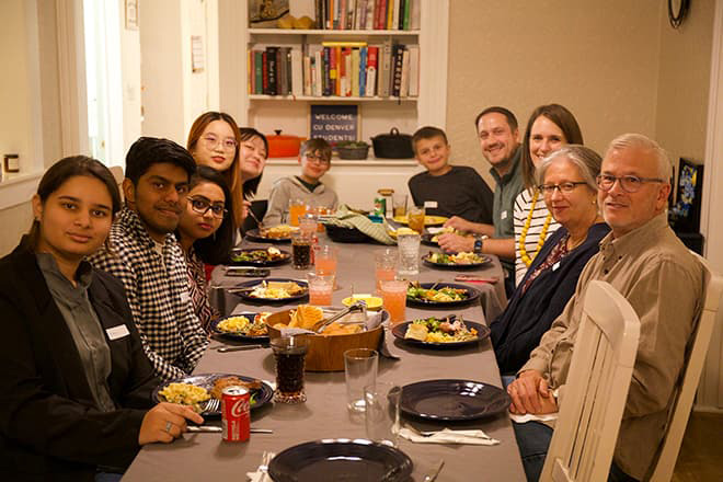 Group of people gathered at a table for a meal.