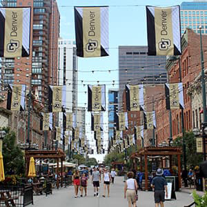 Larimer Square with CU Denver flags and bistro lights hanging.