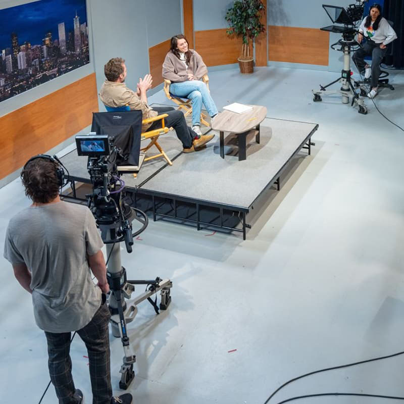 Overhead view of a talk show film set.