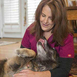 Lisa Nickens snuggling a dog