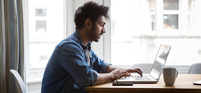 Student working on a laptop from home