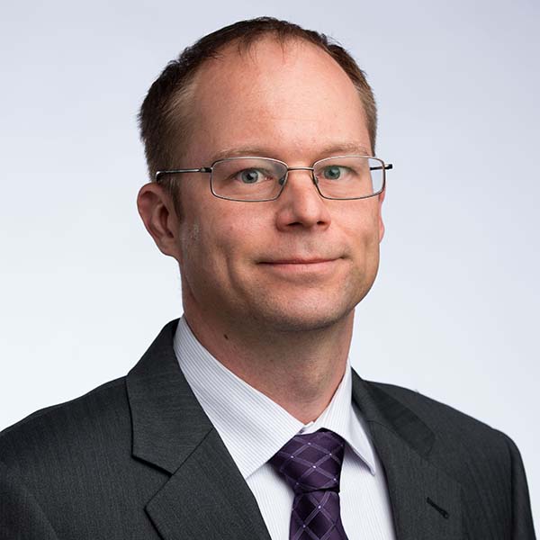 headshot of Steven Lammers from the shoulders up in business suit and tie