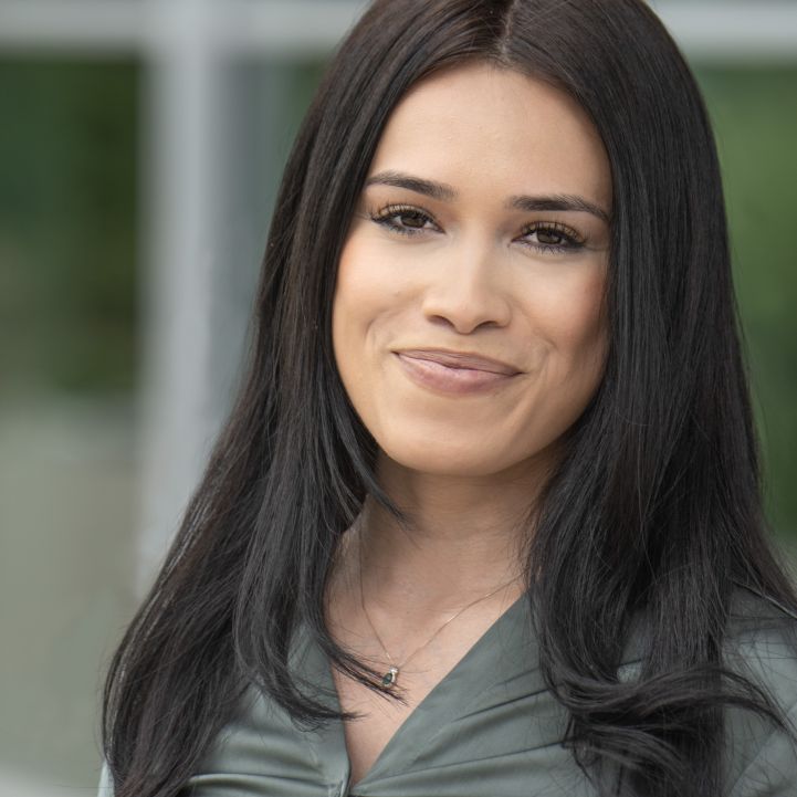 Headshot of Brenda Ortega from the shoulders up smiling in business casual attire