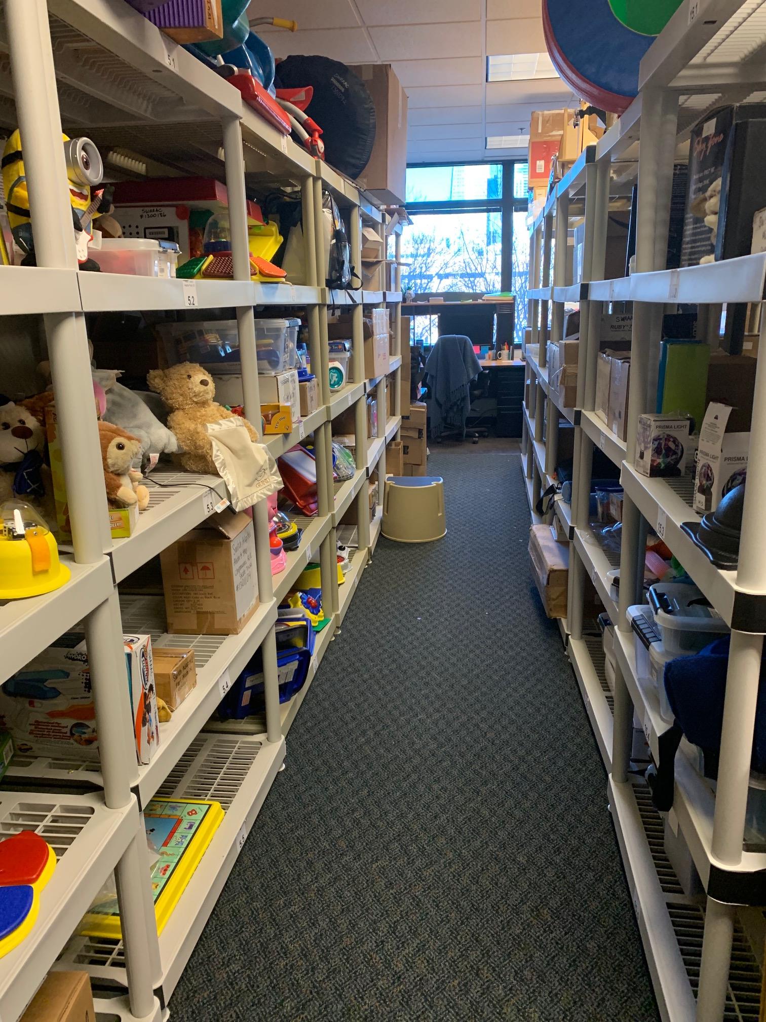 Shelves with cool A.T. toys and devices in the Loan Library.