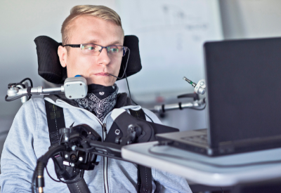 Young man in wheelchair with AT