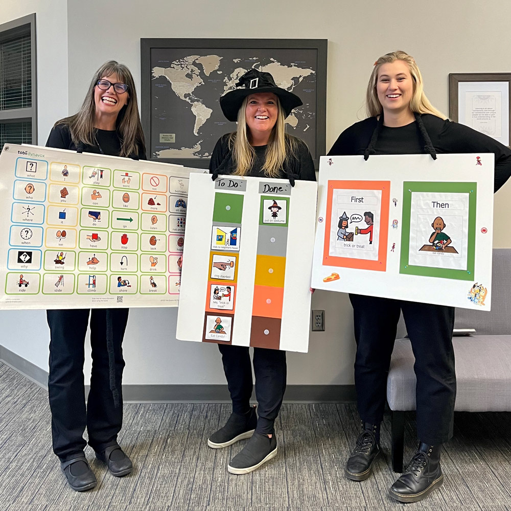 Teachers hold communication posters