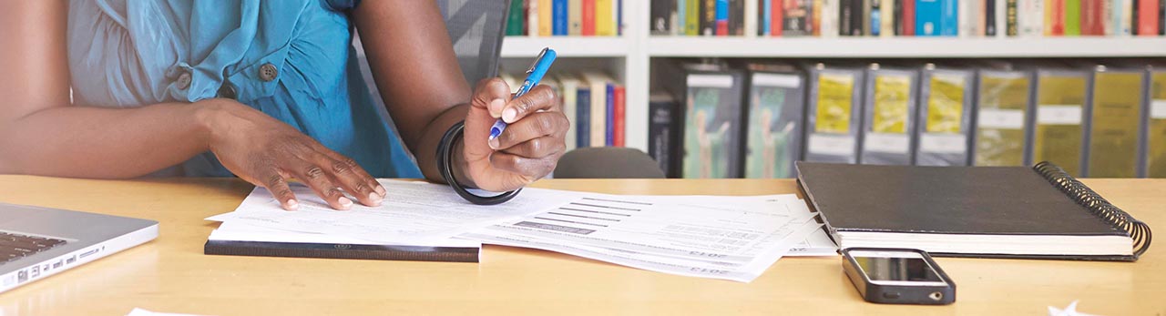 Lady writing on papers